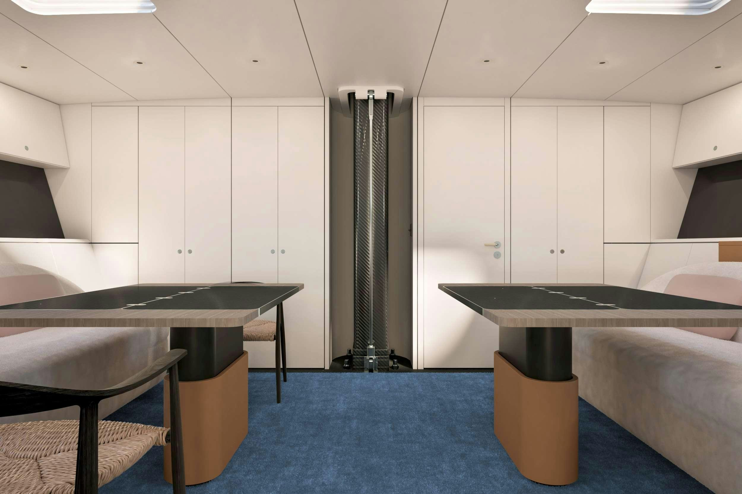 a room with tables and chairs aboard RUNNING ON FAITH Yacht for Charter