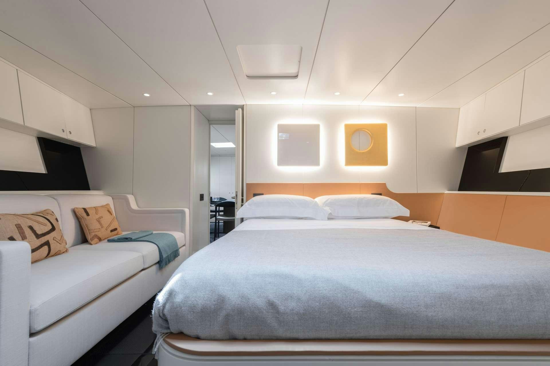 a room with two beds aboard RUNNING ON FAITH Yacht for Charter