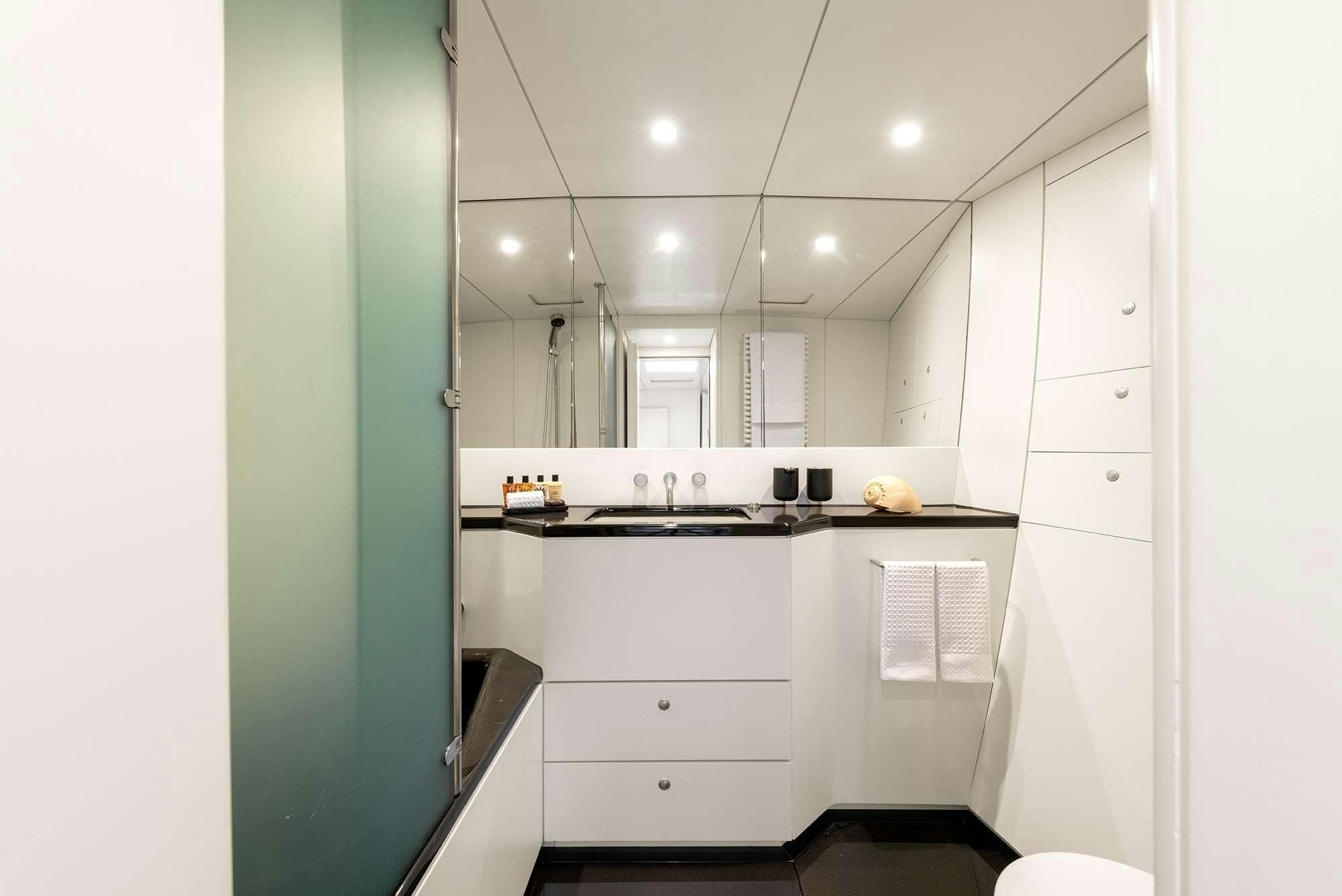 a kitchen with white cabinets aboard RUNNING ON FAITH Yacht for Charter