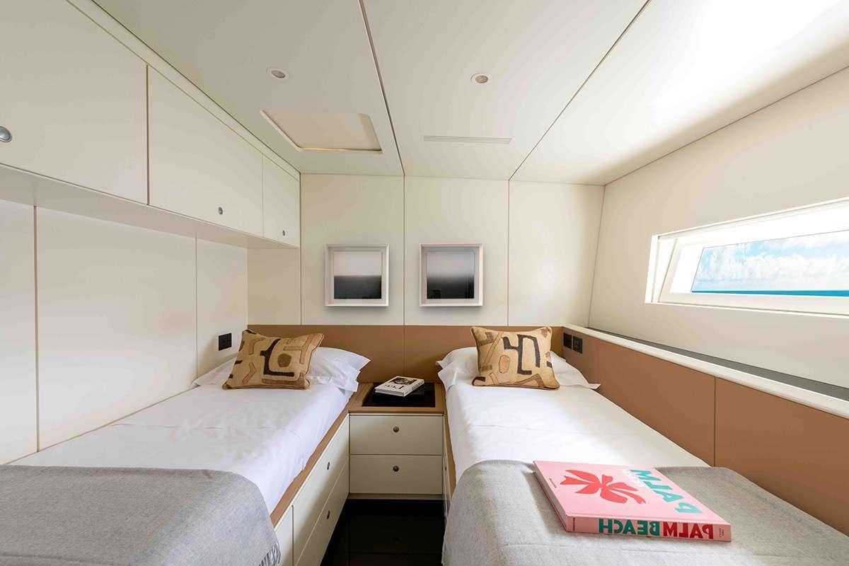 a room with two beds aboard RUNNING ON FAITH Yacht for Charter