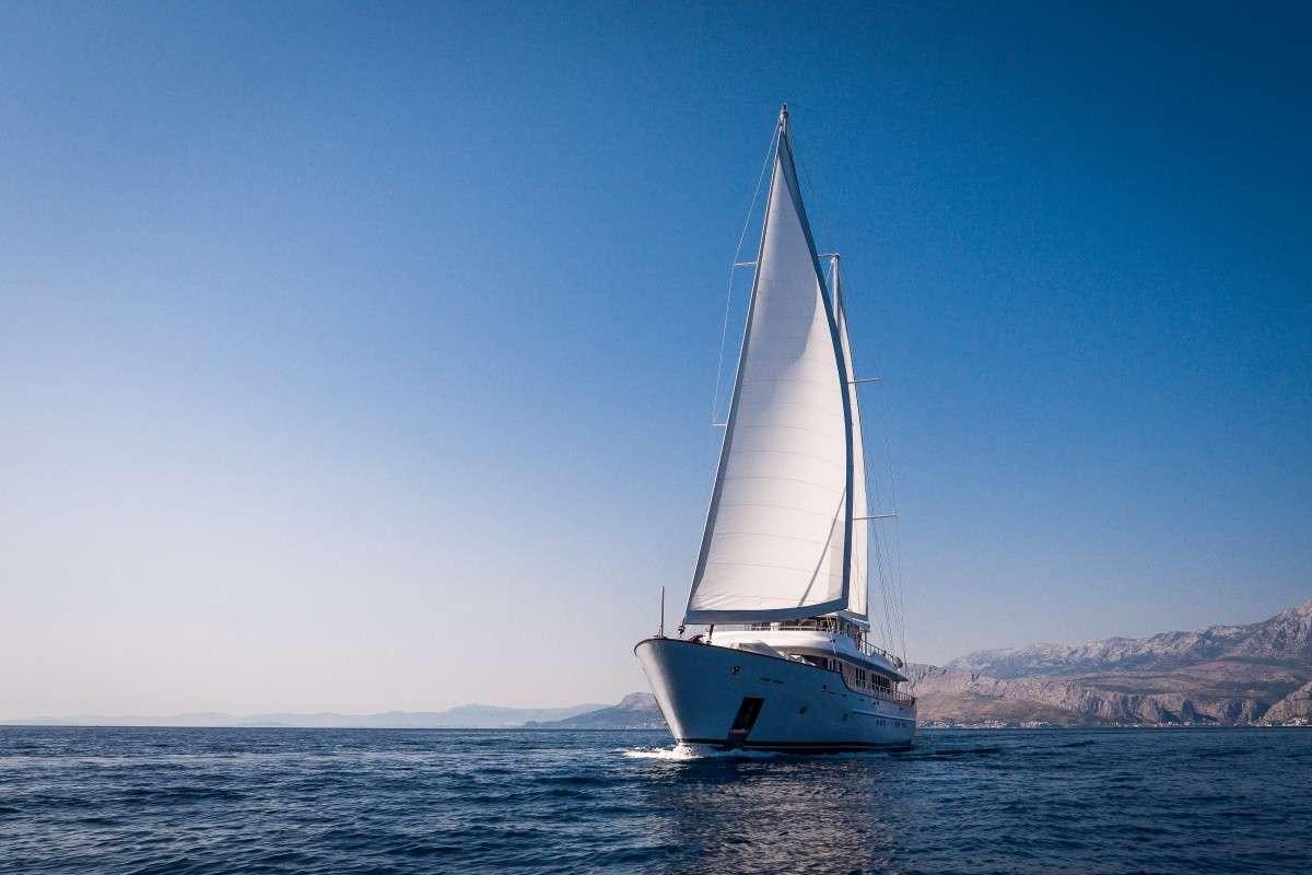 a sailboat on the water aboard OMNIA Yacht for Charter