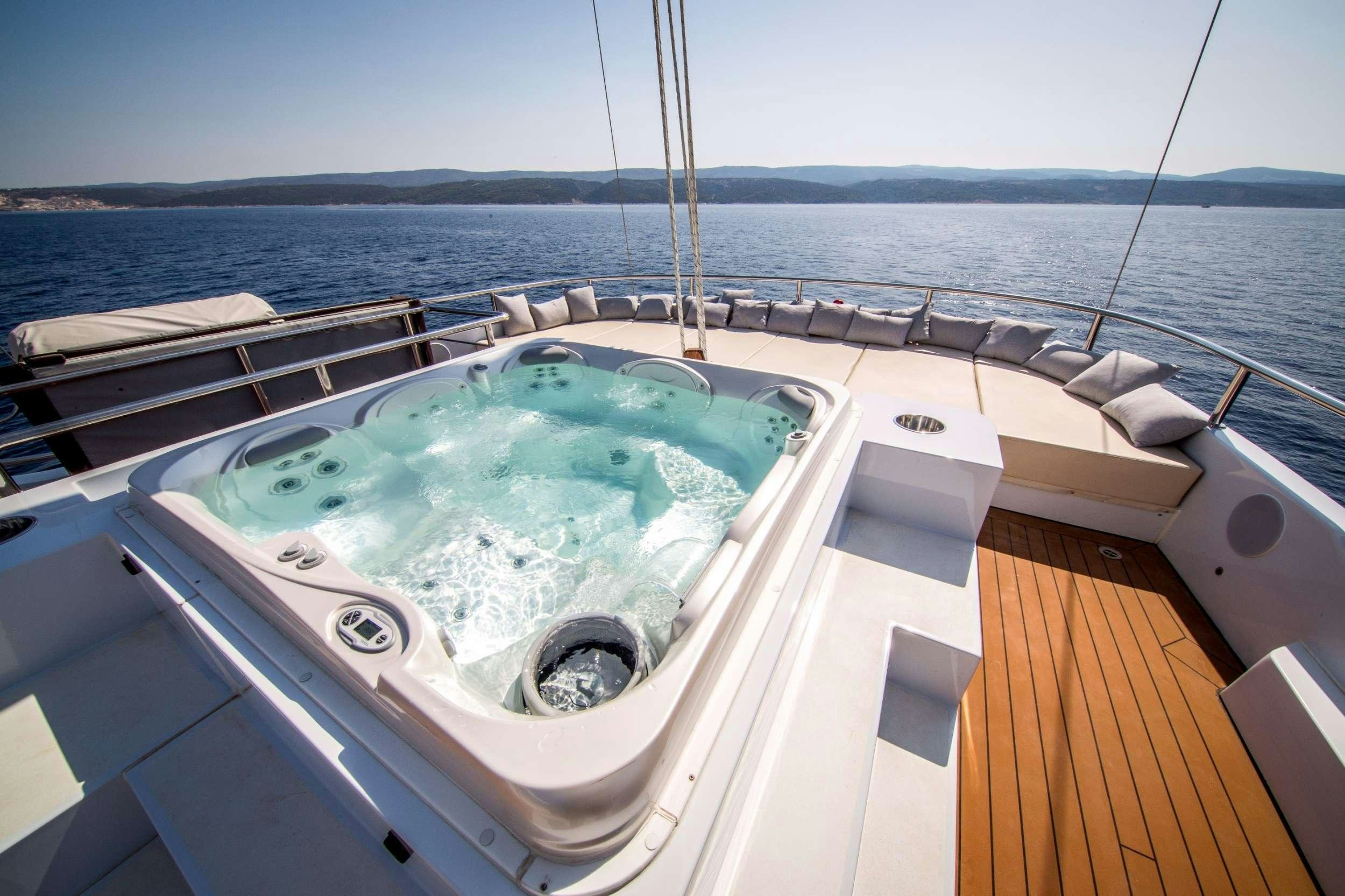 a large white tub on a boat aboard OMNIA Yacht for Charter