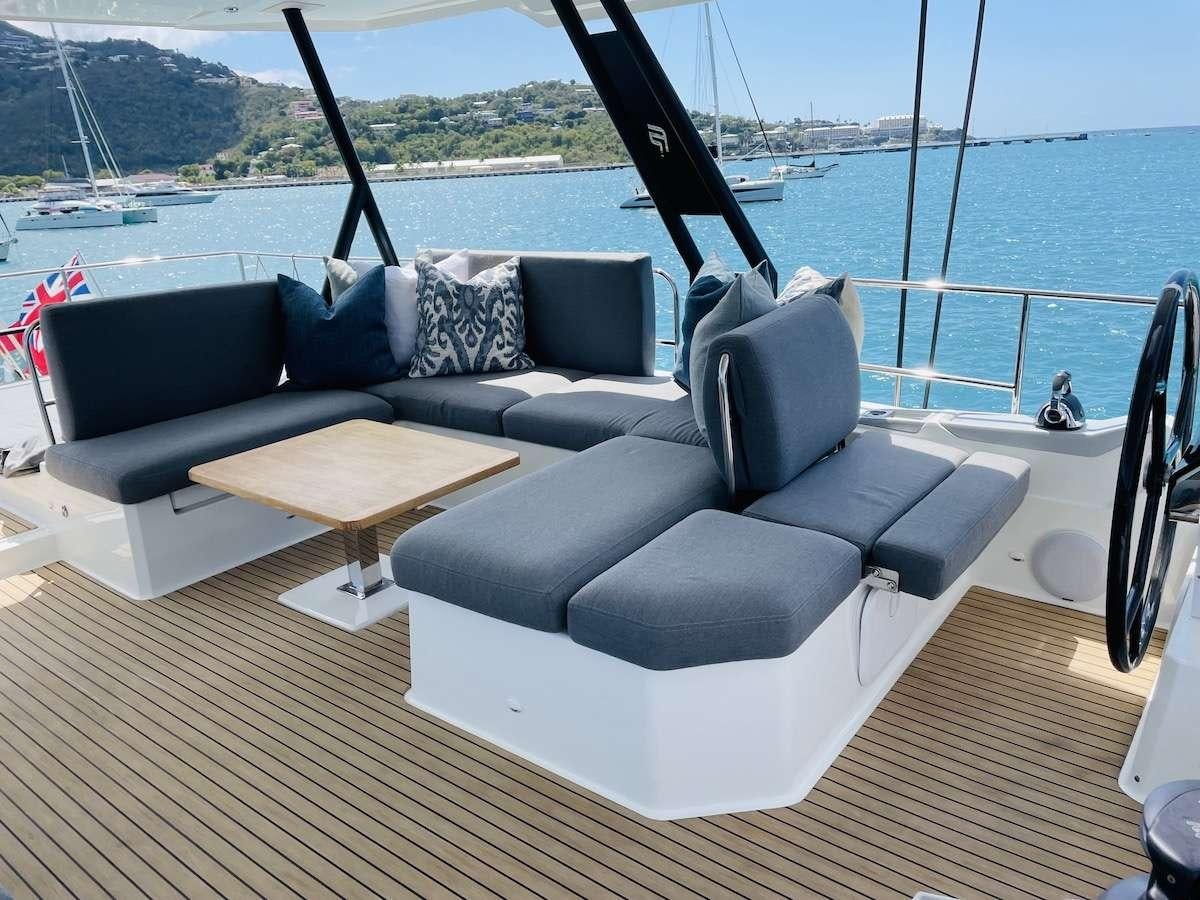 a couch on a deck aboard TRU NORTH Yacht for Charter