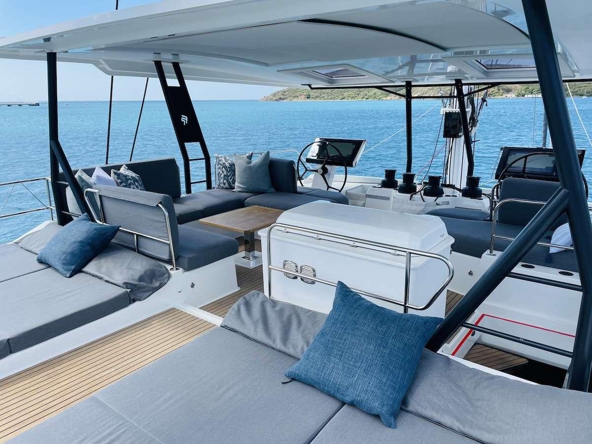 a boat with pillows and a bed aboard TRU NORTH Yacht for Charter