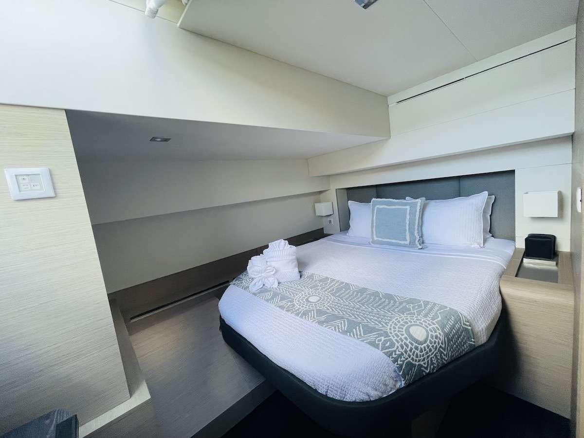 a bed in a room aboard TRU NORTH Yacht for Charter