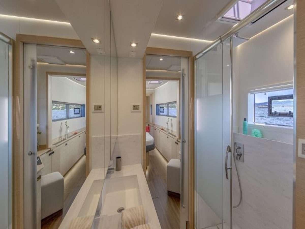 a hallway with glass doors aboard TRU NORTH Yacht for Charter