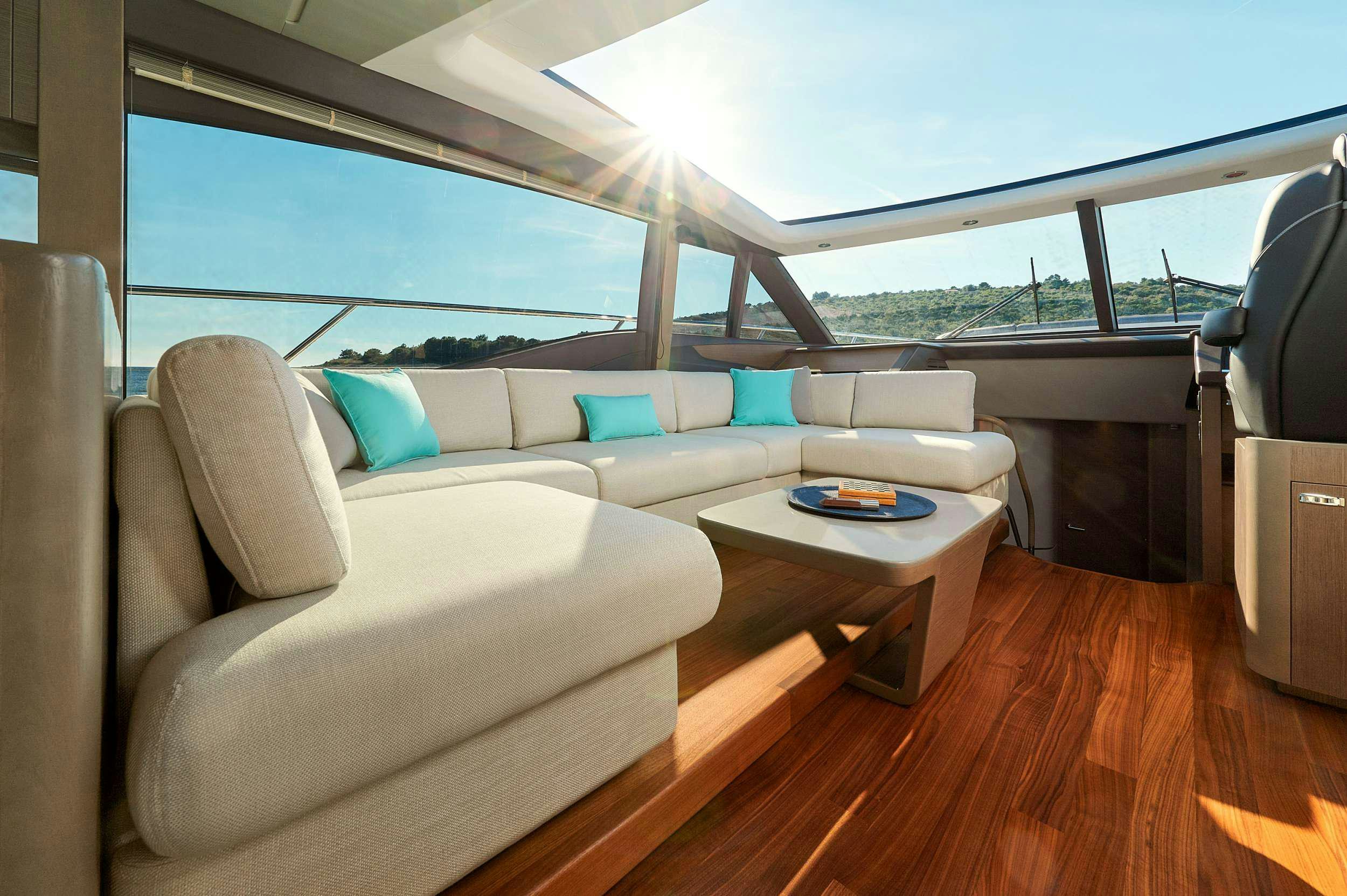 a living room with a large window aboard MESOFA Yacht for Charter