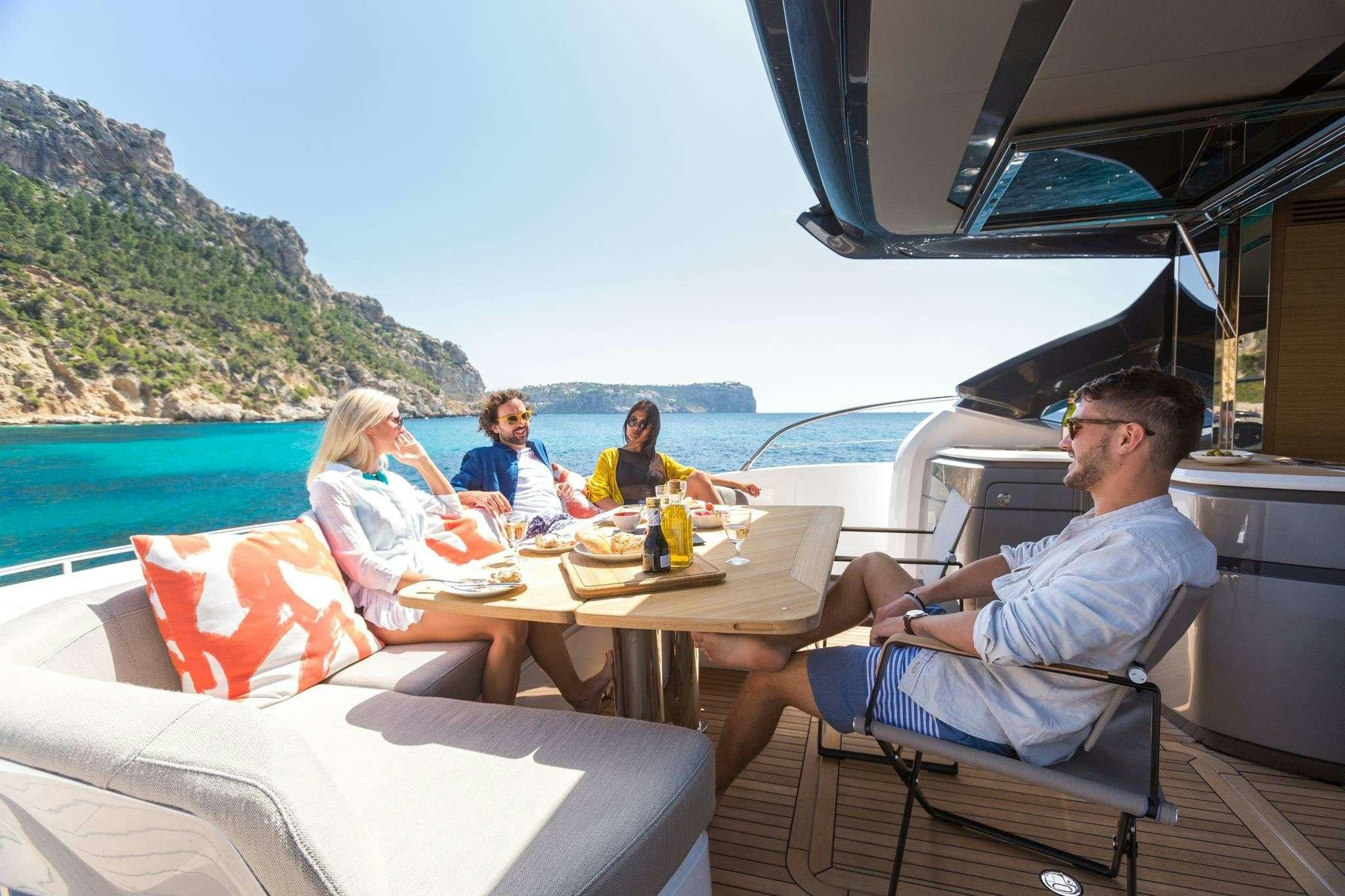 people sitting at a table on a boat aboard MESOFA Yacht for Charter