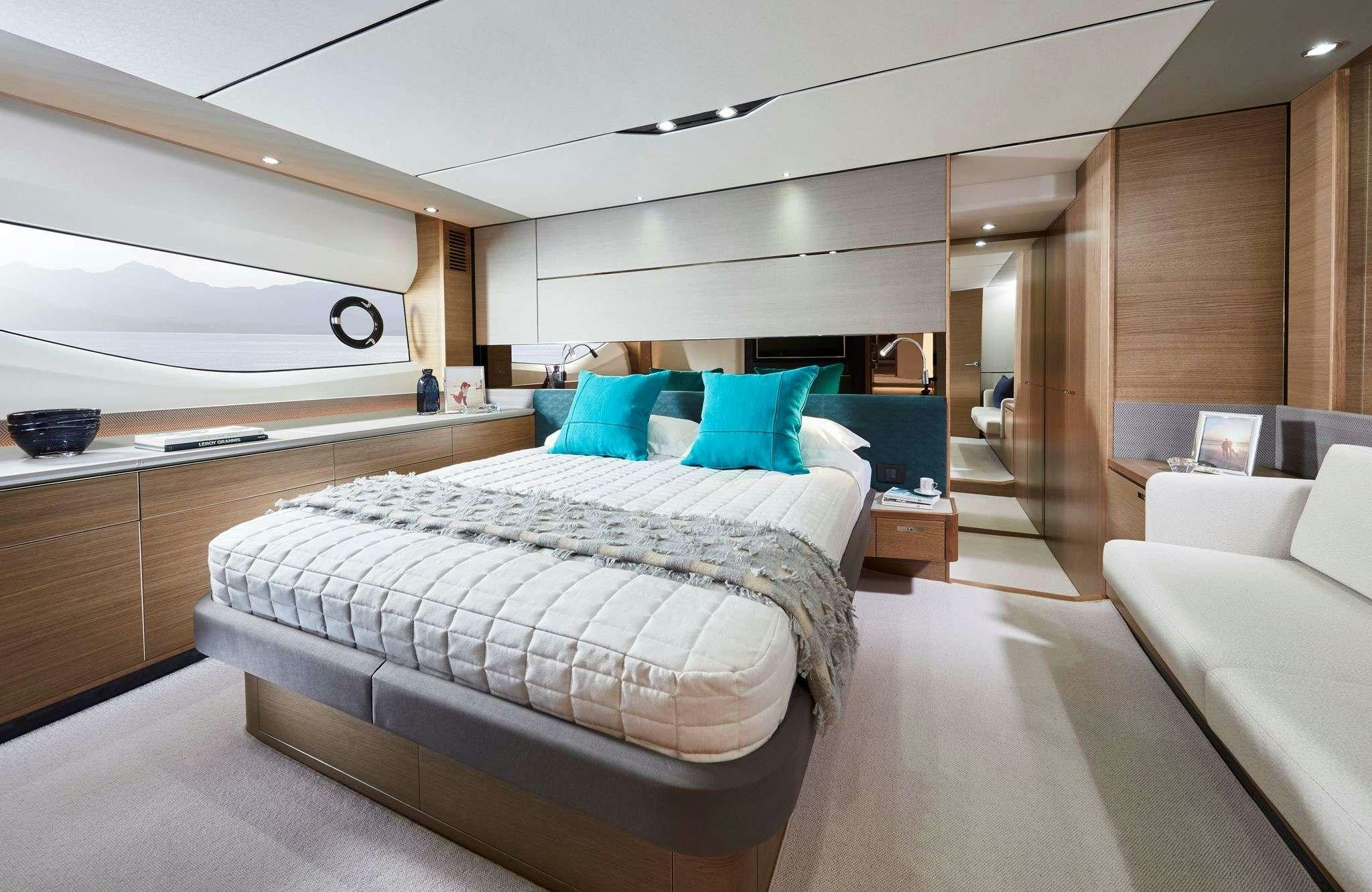 a room with a bed and a couch aboard MESOFA Yacht for Charter