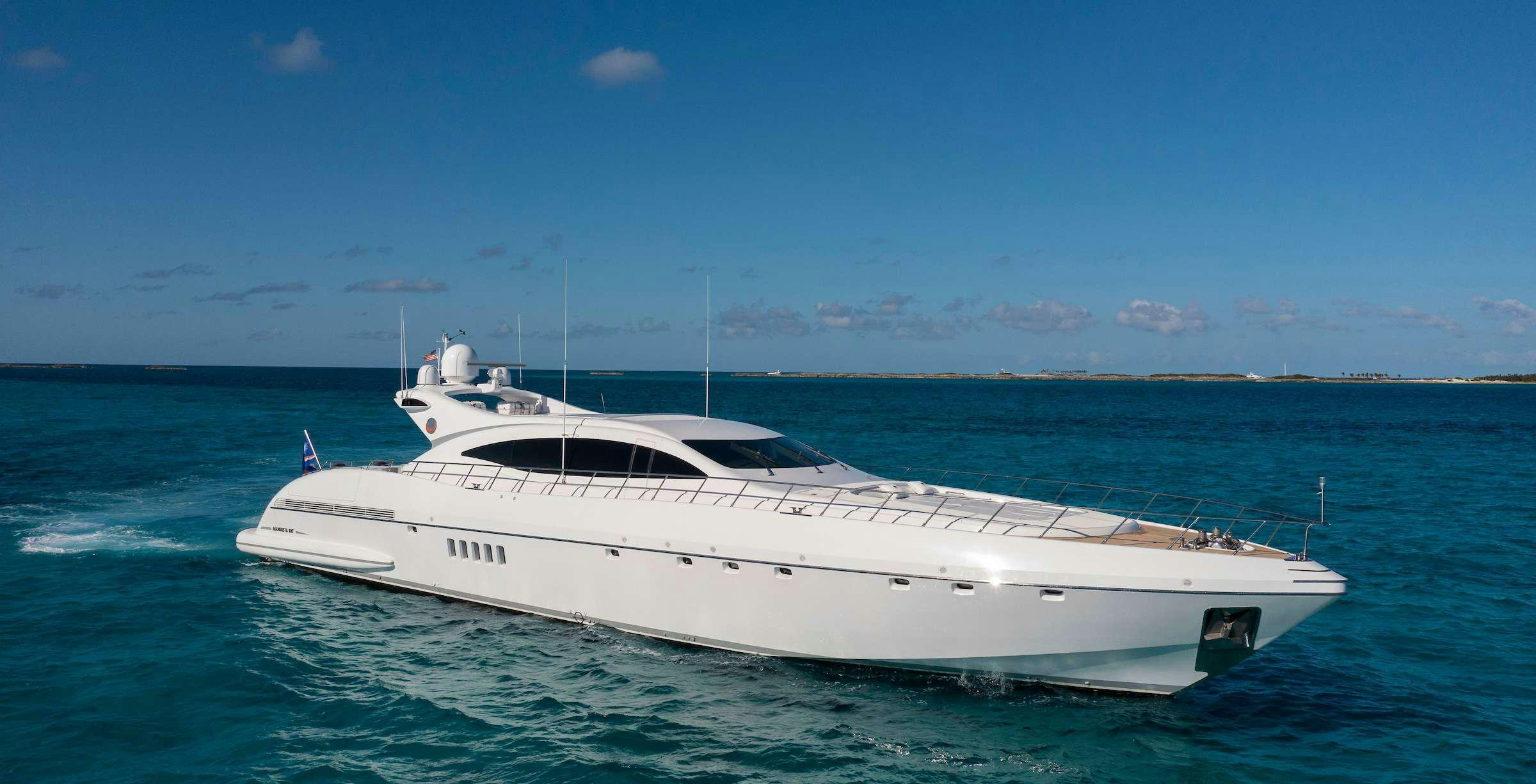 a white yacht in the water aboard TOTAL Yacht for Charter