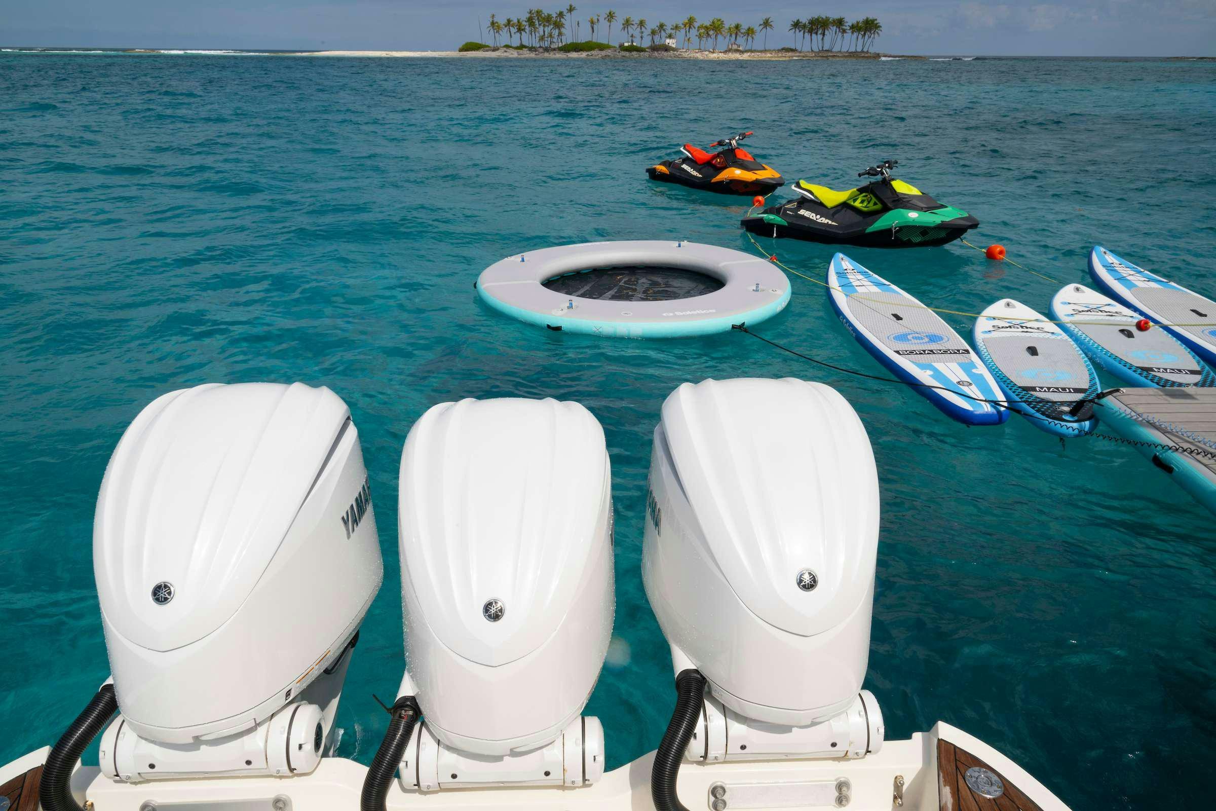a group of boats on a body of water aboard TOTAL Yacht for Charter