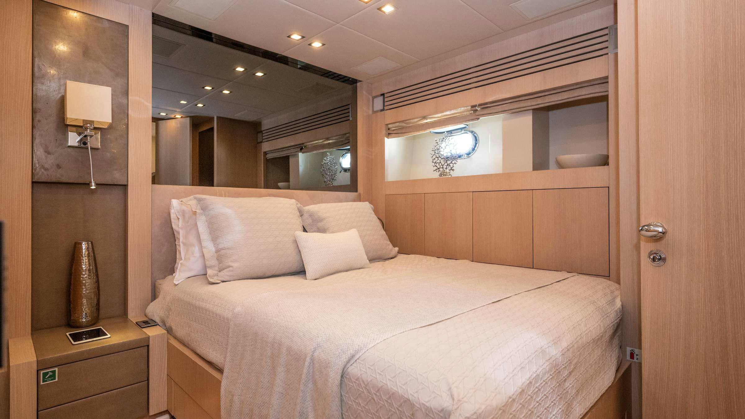 a bed in a room aboard TOTAL Yacht for Charter