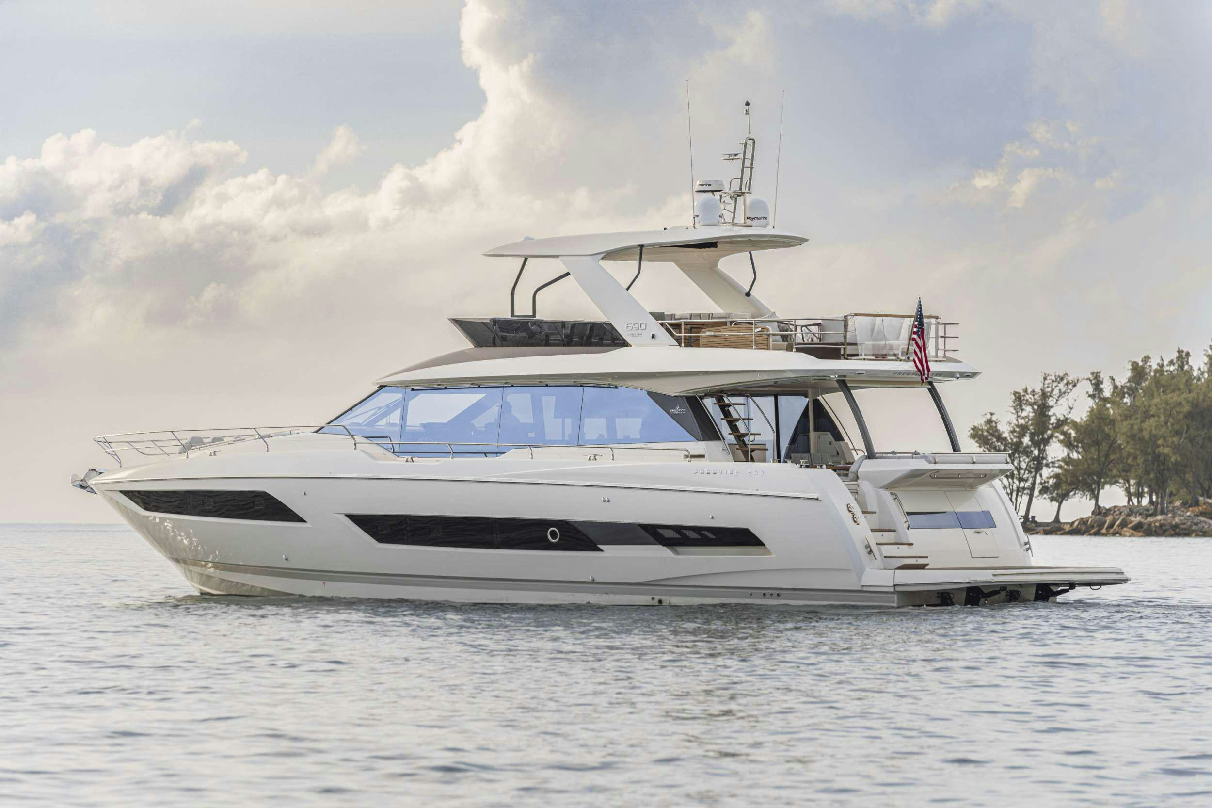 a white boat on the water aboard BAZINGA Yacht for Charter