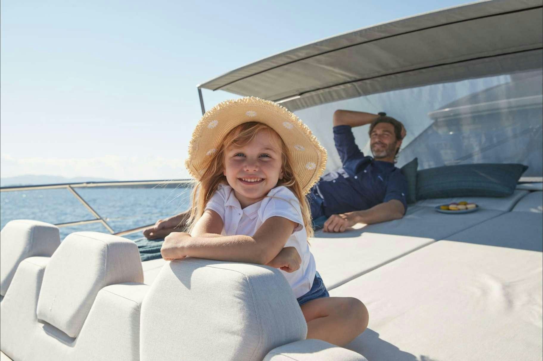 a person and a girl sitting on a boat aboard BAZINGA Yacht for Charter