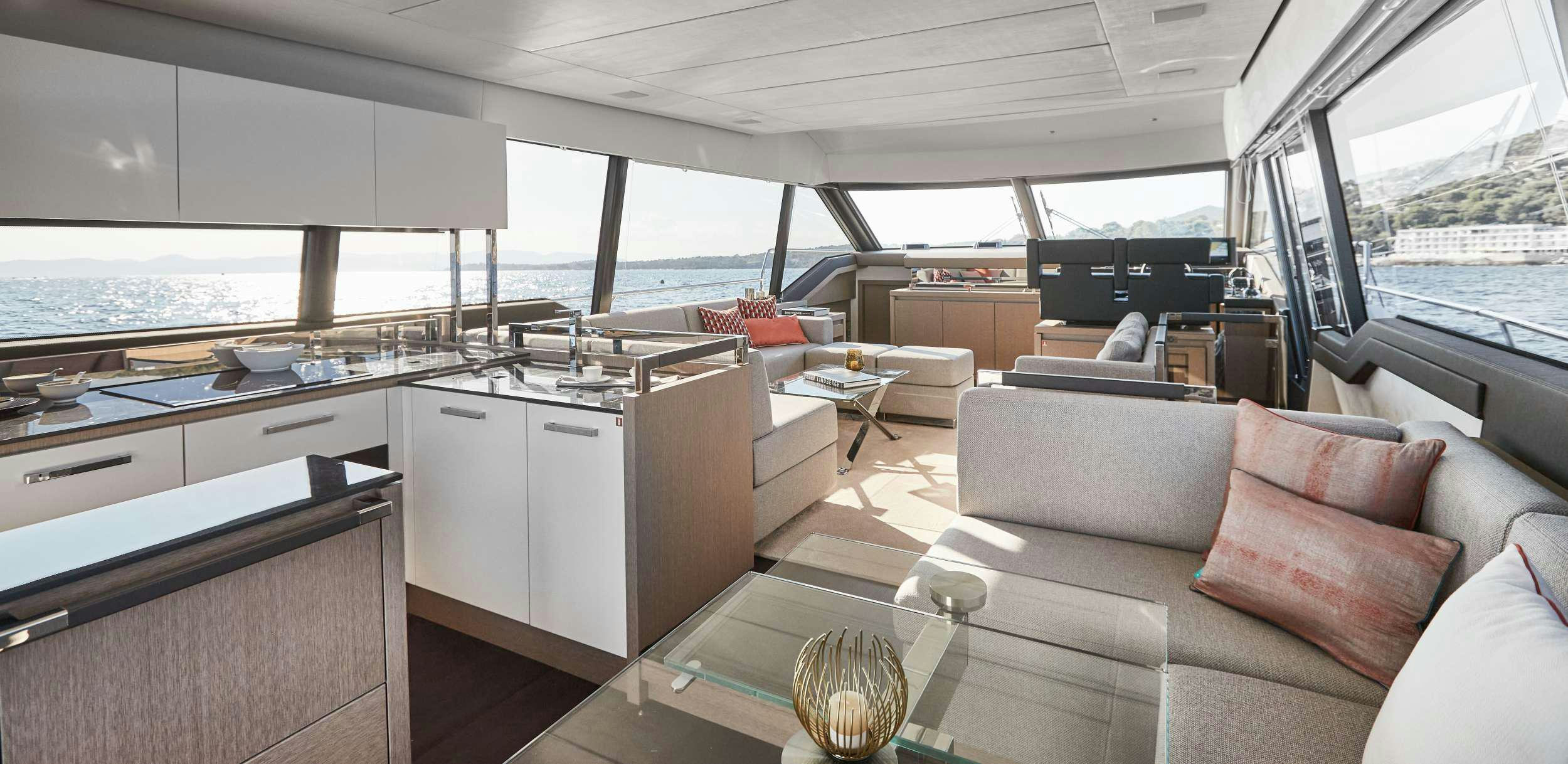a living room with a couch and a table aboard BAZINGA Yacht for Charter