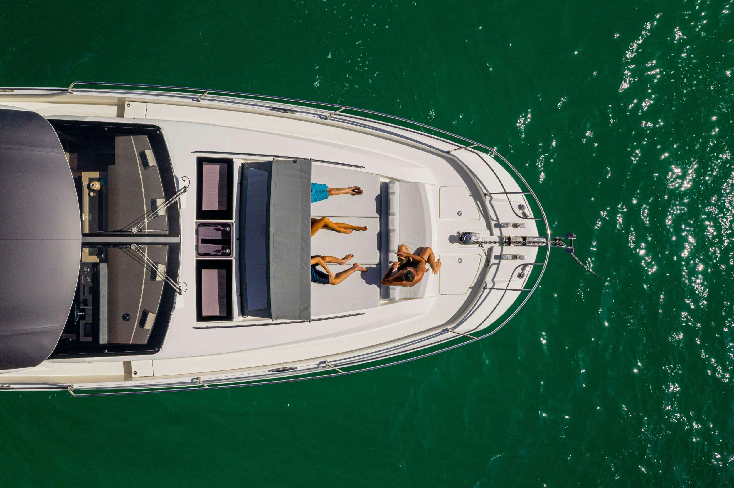 a white vehicle with a door and a person on the side aboard BAZINGA Yacht for Charter