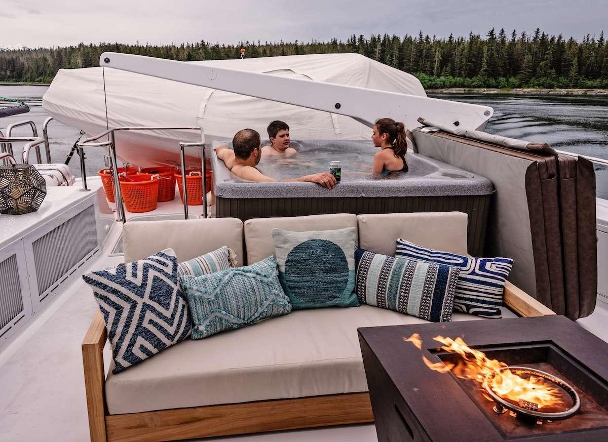 a group of people sitting on a boat aboard DAUNTLESS Yacht for Charter