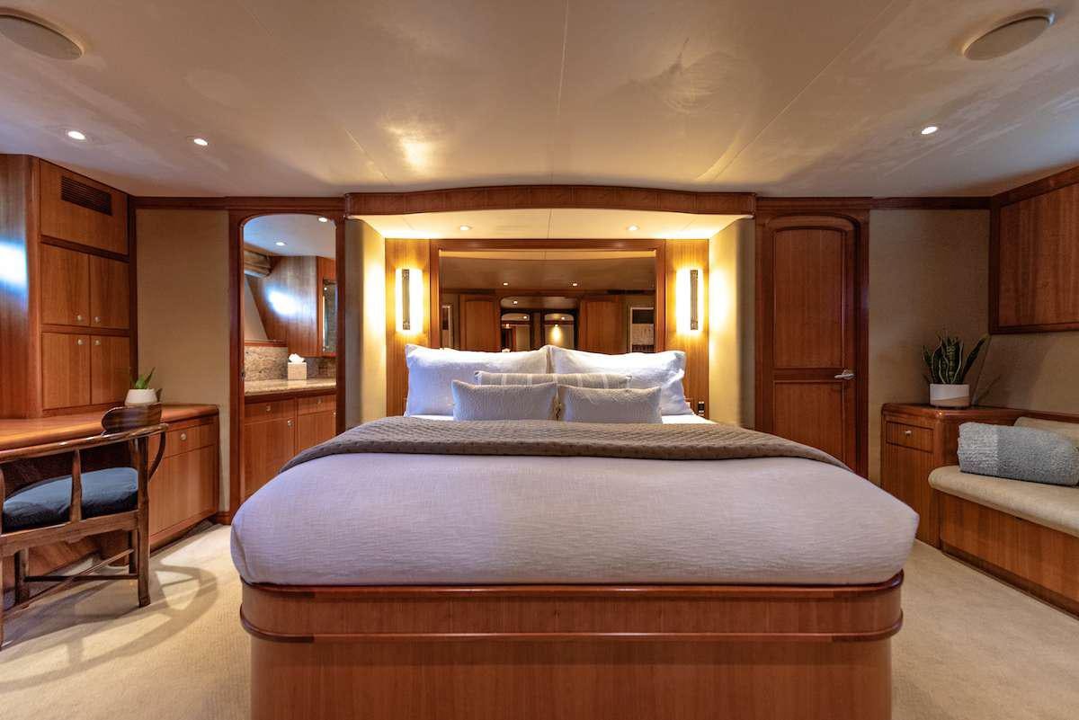a large bed in a room aboard DAUNTLESS Yacht for Charter