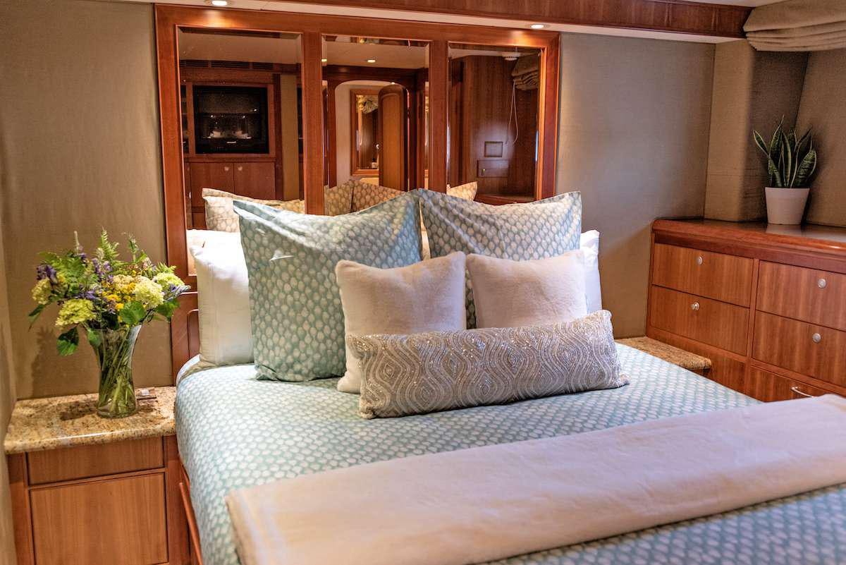a bed with pillows aboard DAUNTLESS Yacht for Charter