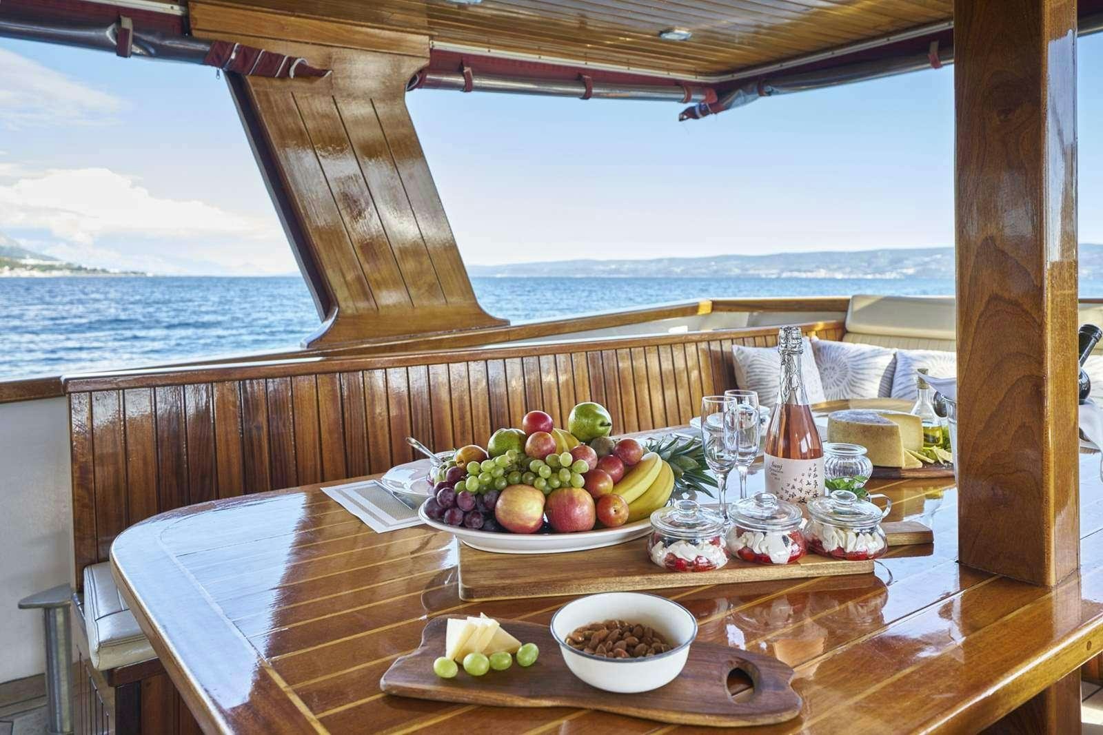 a table with food on it aboard CATALEYA Yacht for Charter