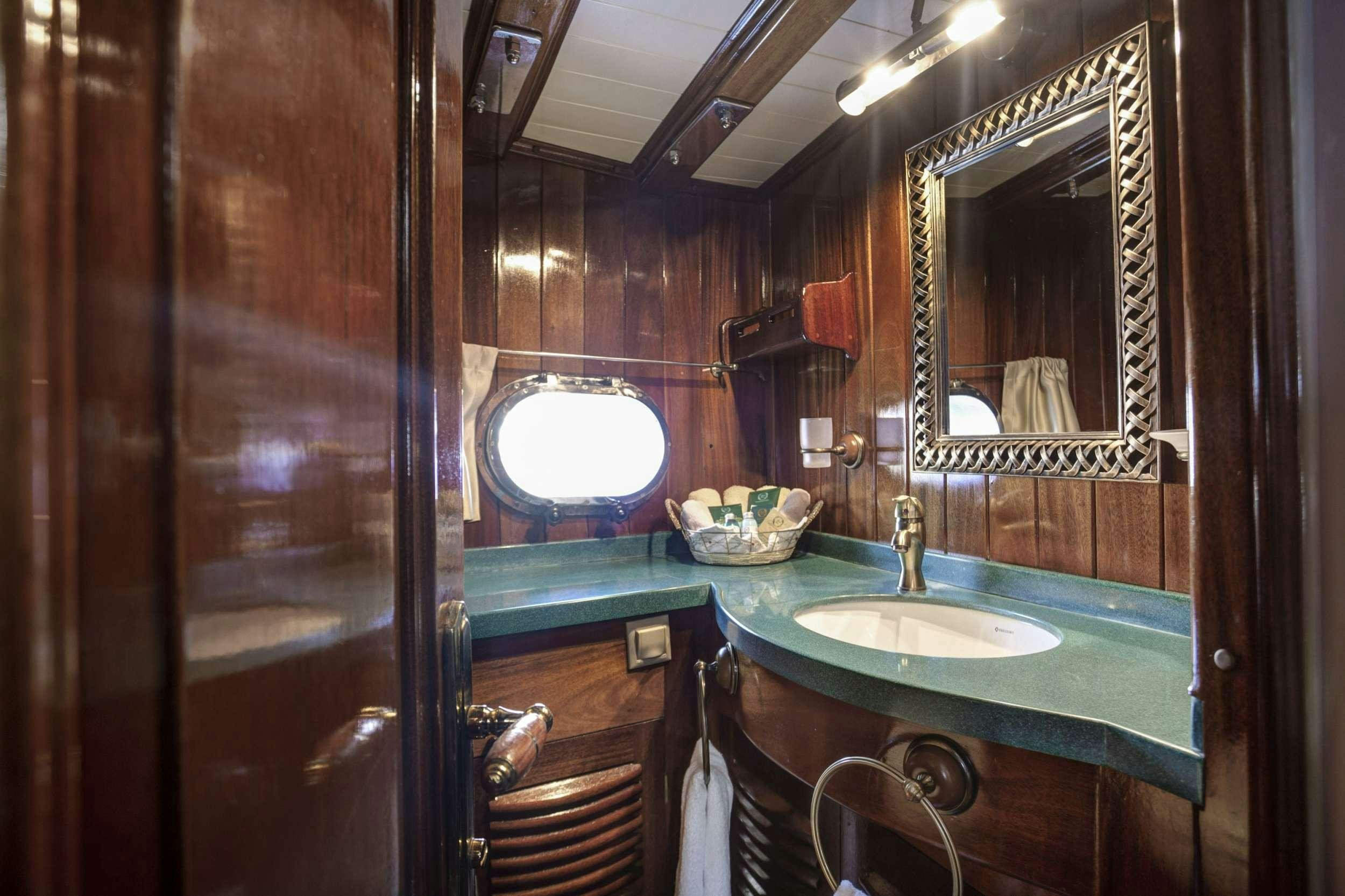 a bathroom with a large mirror aboard ENTRE CIELOS Yacht for Charter