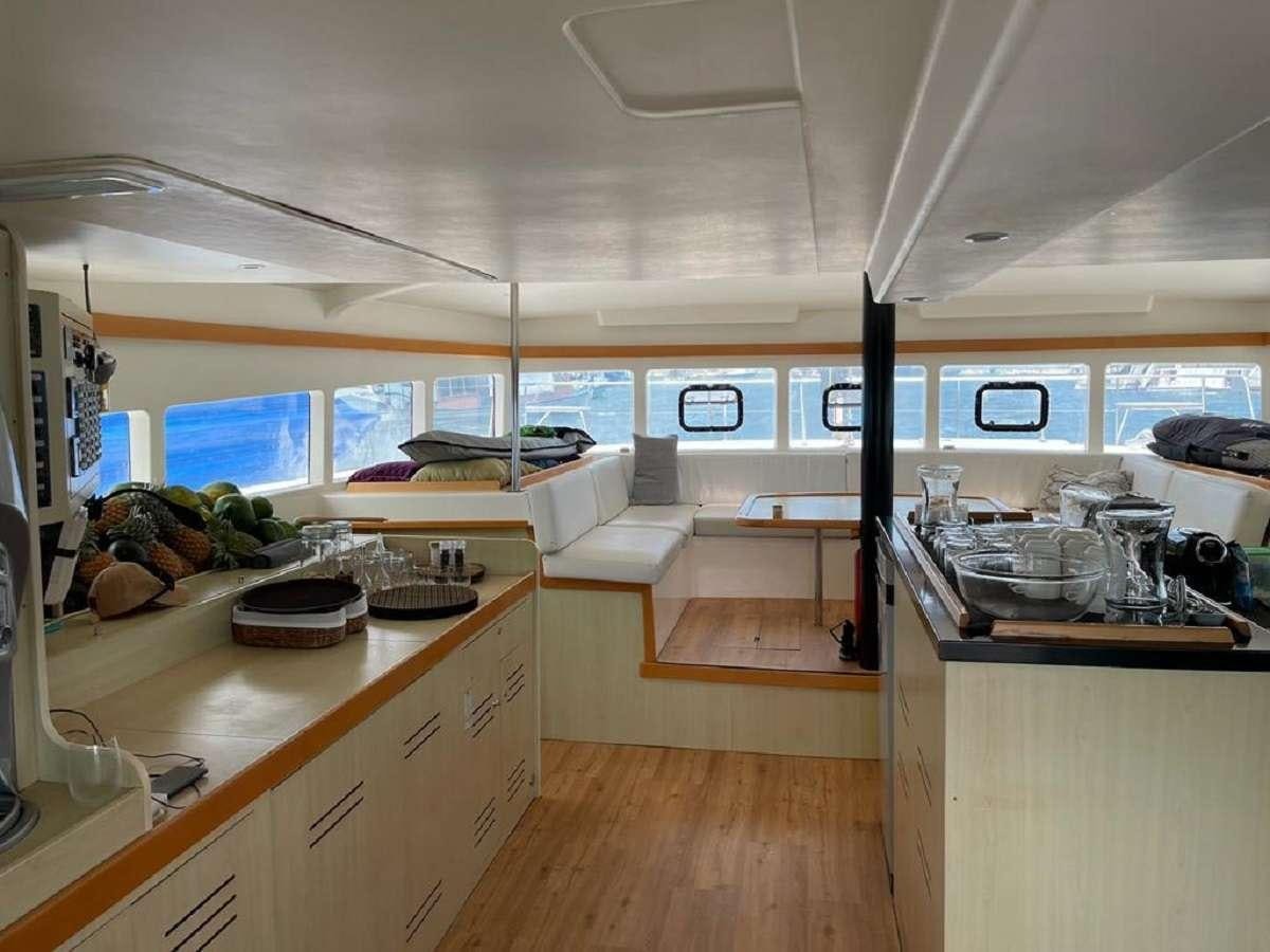 a kitchen with a large window aboard DREAM CORSICA Yacht for Charter
