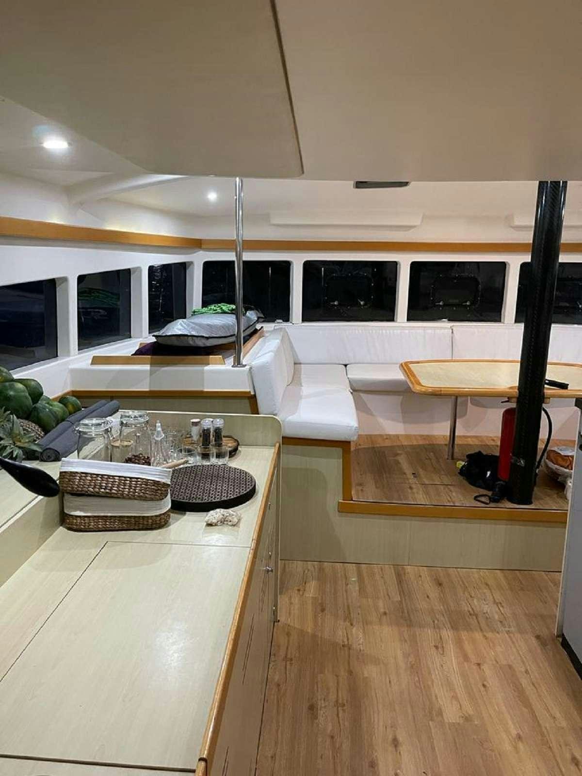 a room with a table and chairs aboard DREAM CORSICA Yacht for Charter