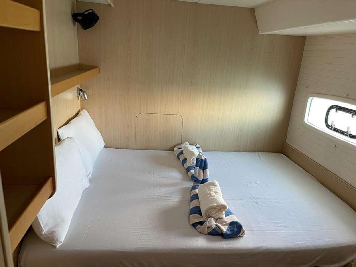 a pair of socks on a bed aboard DREAM CORSICA Yacht for Charter