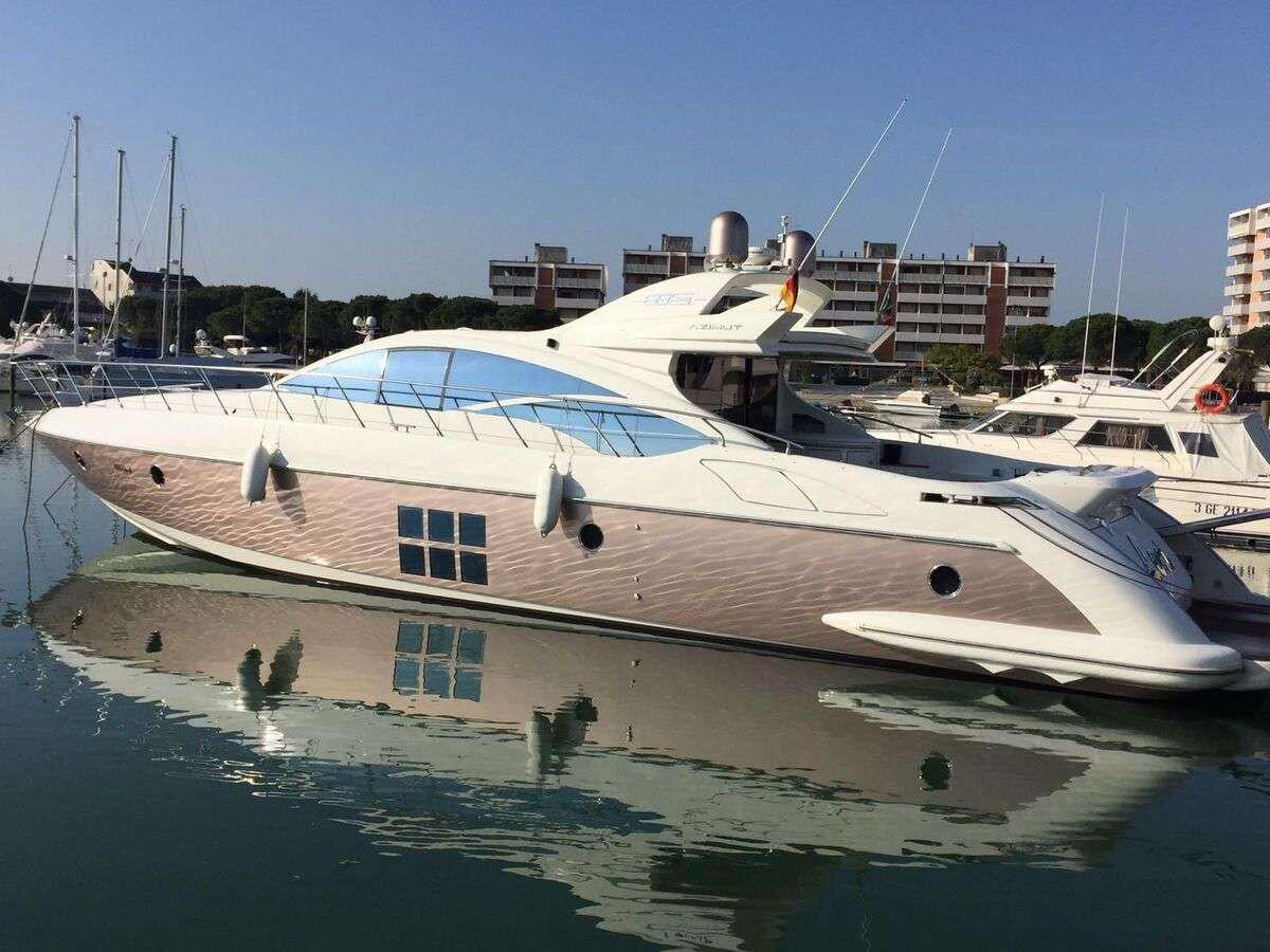 a group of boats in a harbor aboard ZIPI ZAPE Yacht for Charter