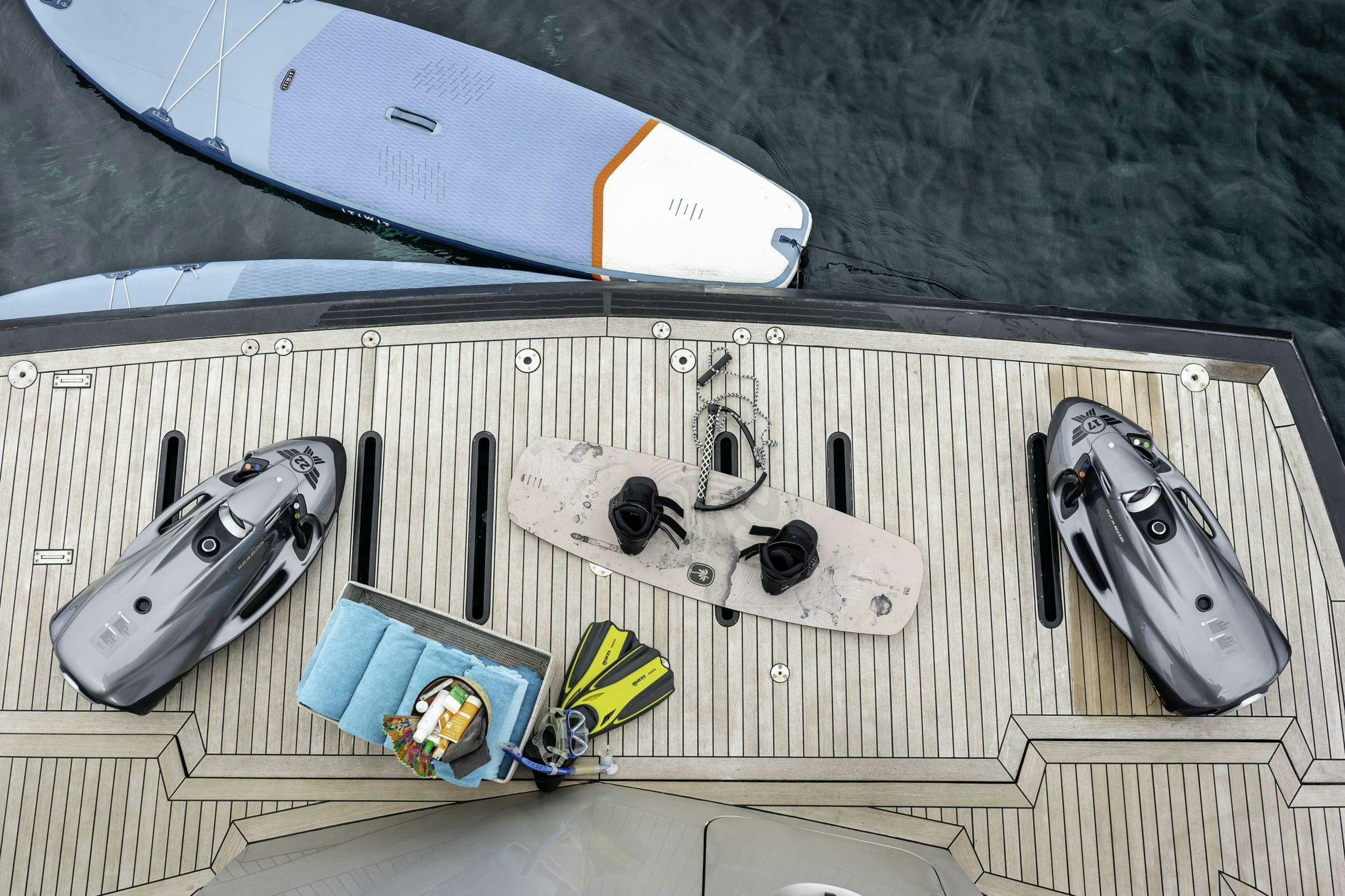a laptop and a couple of phones aboard AMMONITE Yacht for Charter