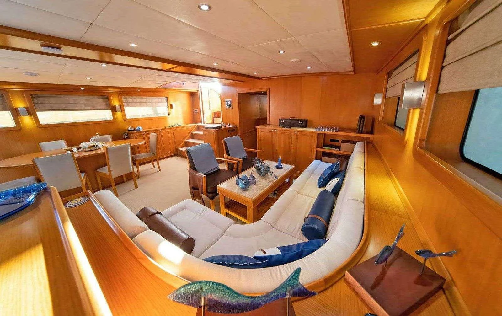 a room with a couch and a television aboard BABYLON Yacht for Charter