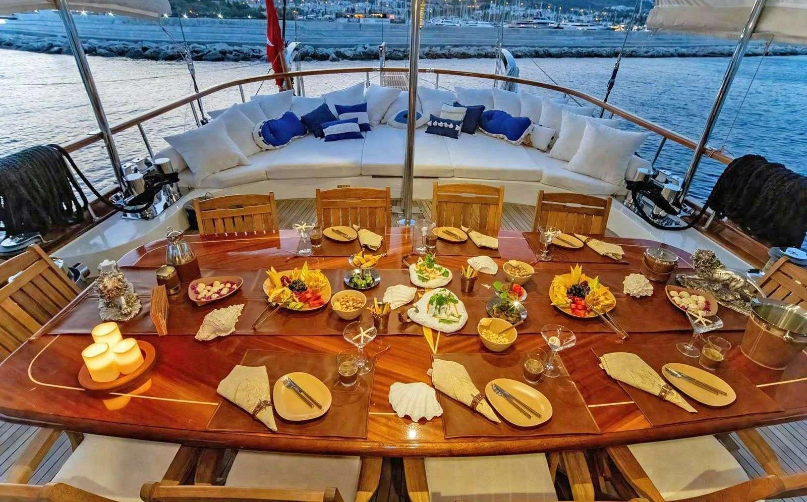 a table with food on it aboard BABYLON Yacht for Charter