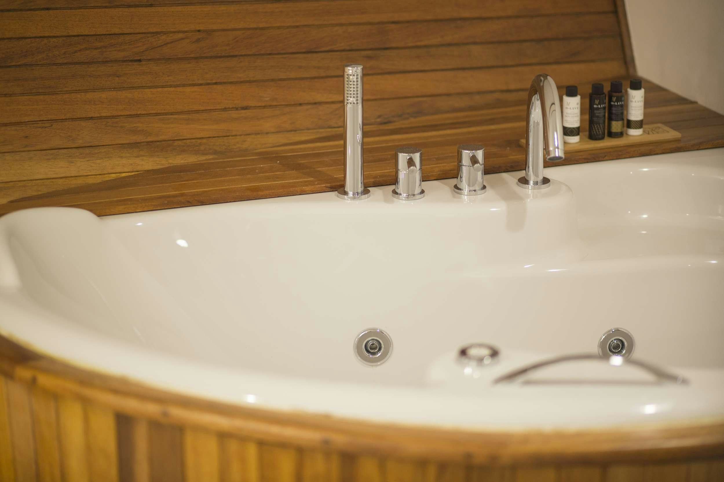 a sink with a faucet aboard COSMOS Yacht for Charter