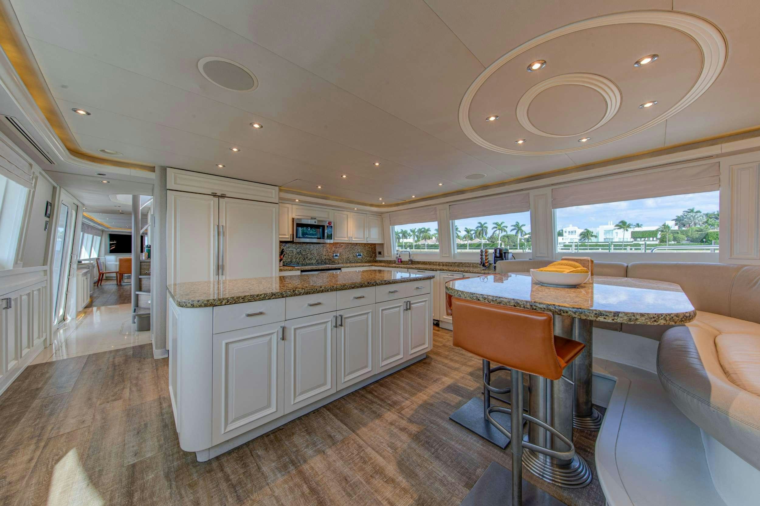 a kitchen and dining area aboard SPIRIT Yacht for Charter