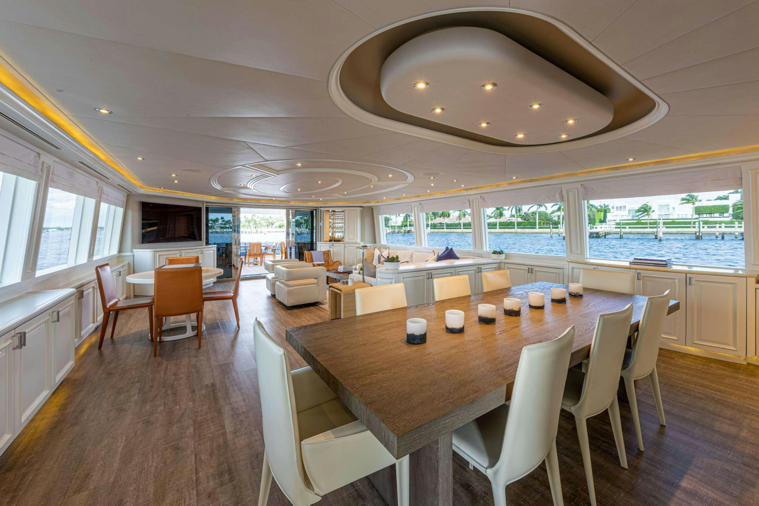 a large room with tables and chairs aboard SPIRIT Yacht for Charter