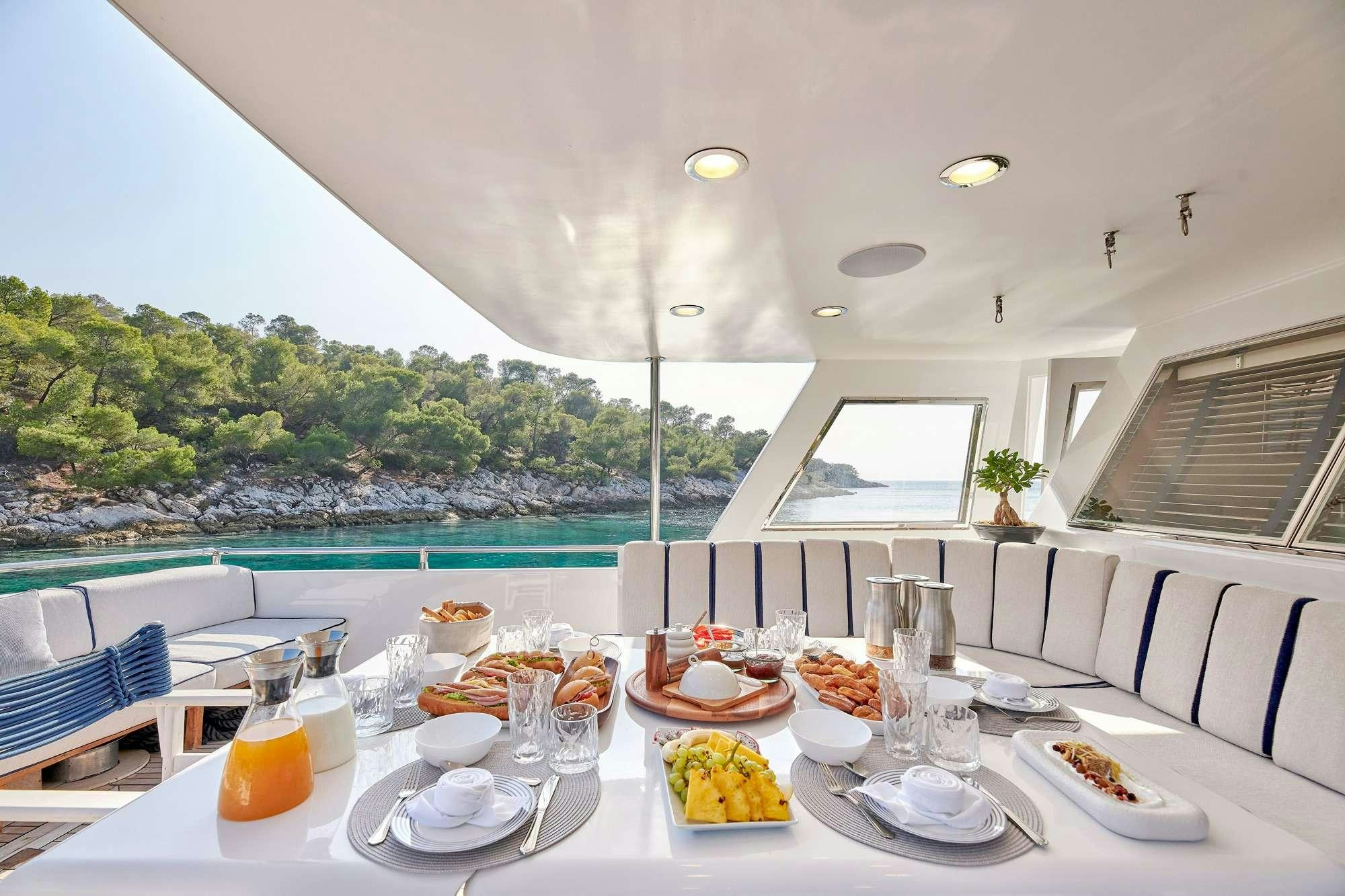 a table with food on it aboard ALAYA Yacht for Charter