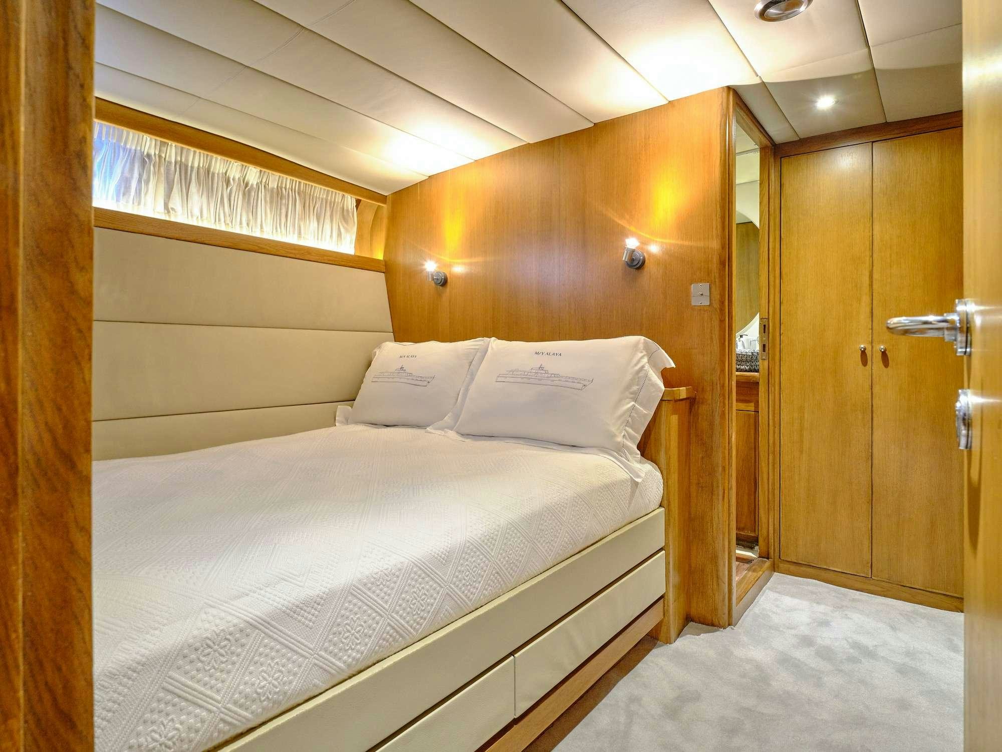 a room with two beds aboard ALAYA Yacht for Charter