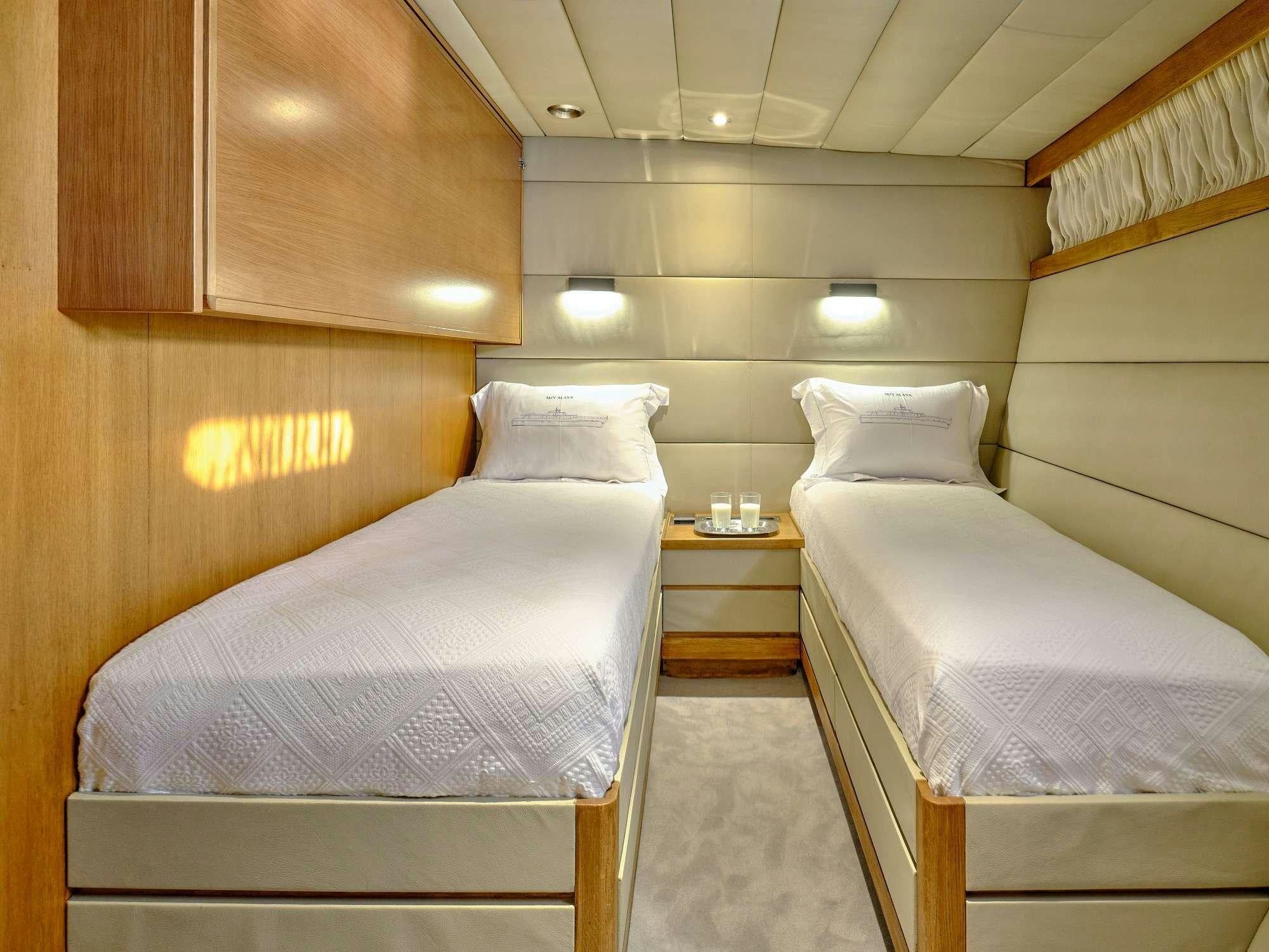 a room with two beds aboard ALAYA Yacht for Charter