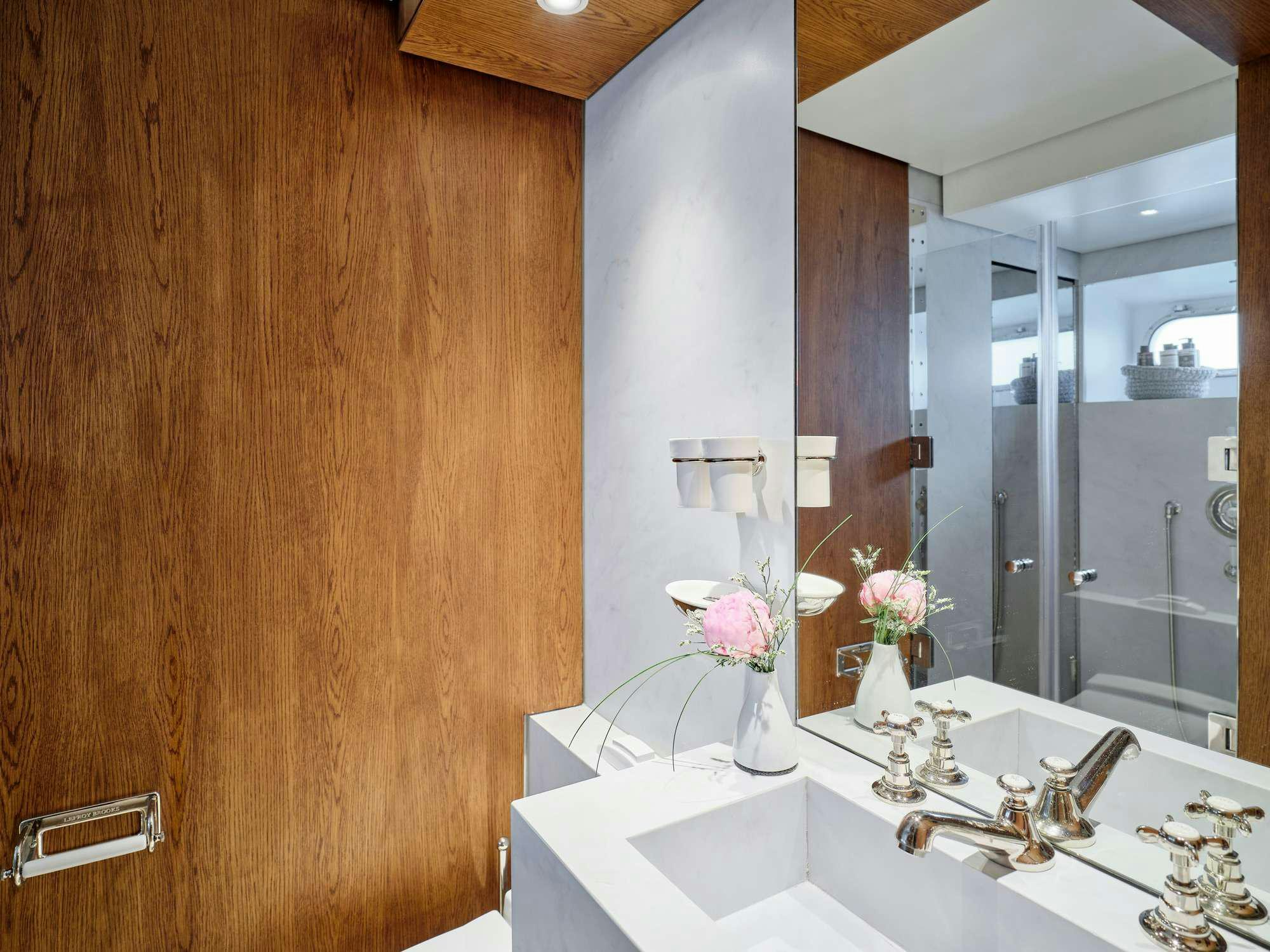 a bathroom with a large mirror aboard ALAYA Yacht for Charter