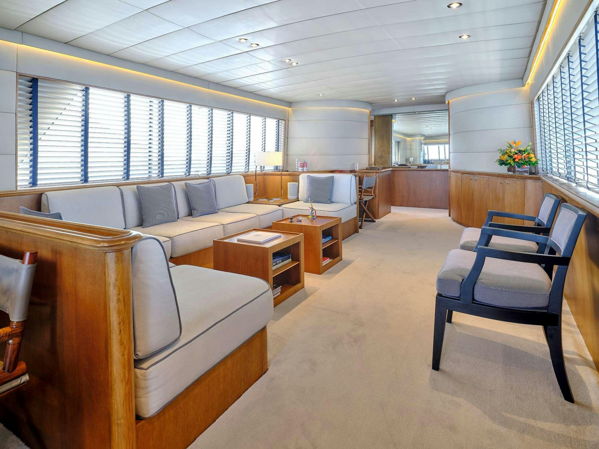 a large room with couches and a table aboard ALAYA Yacht for Charter