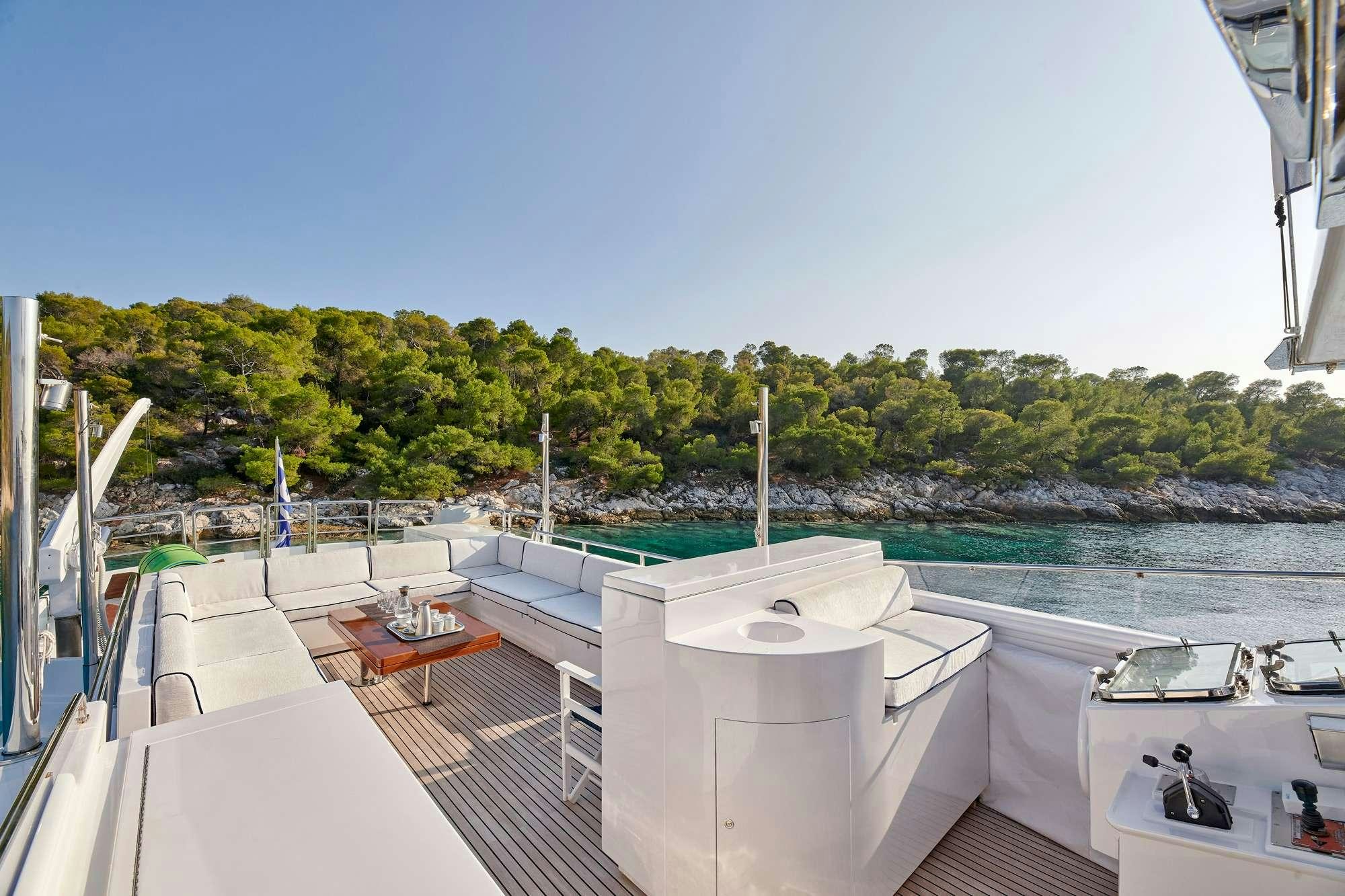 a deck with a view of a city and water aboard ALAYA Yacht for Charter