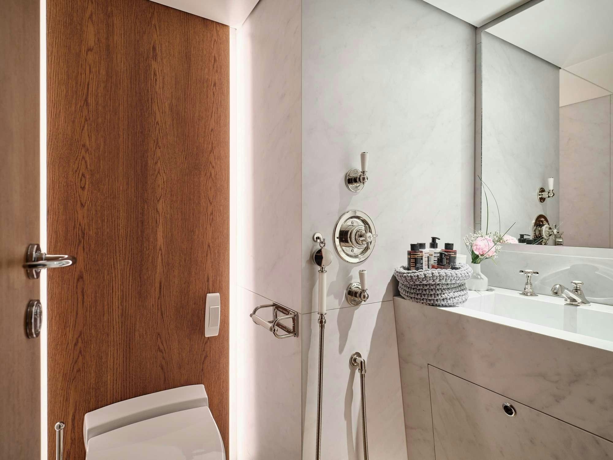 a bathroom with a toilet and sink aboard ALAYA Yacht for Charter