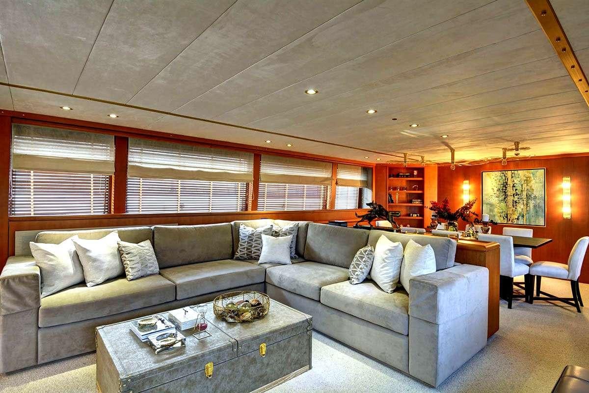 a living room with a couch and a table aboard KARMA Yacht for Charter