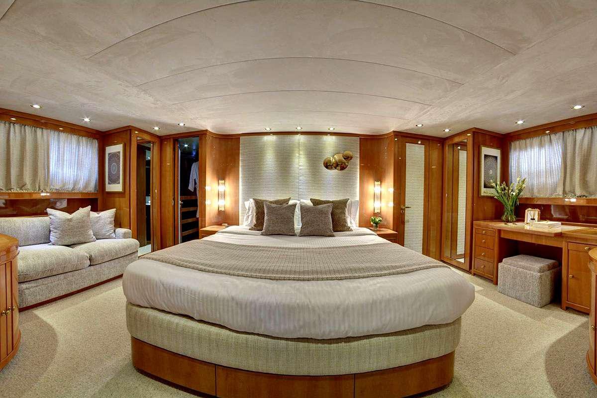 a large bed in a room aboard KARMA Yacht for Charter