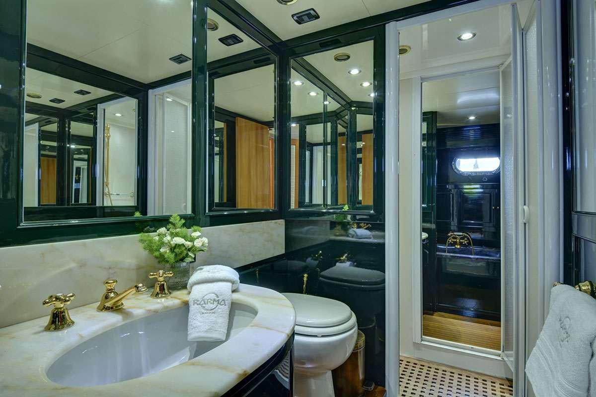 a bathroom with a large mirror aboard KARMA Yacht for Charter