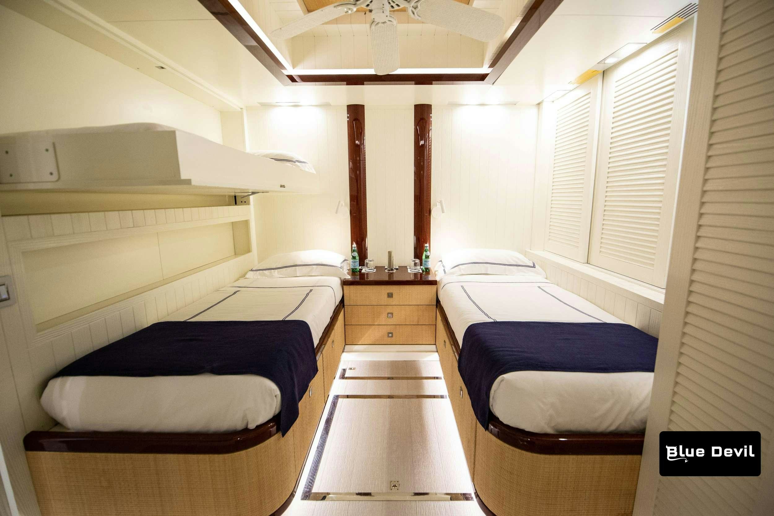 a room with bunk beds aboard BLUE DEVIL Yacht for Charter