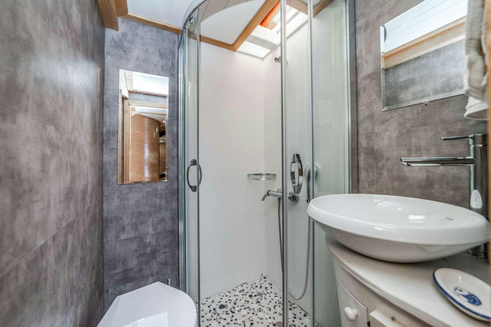a bathroom with a sink and a toilet aboard AMAZON SOLO Yacht for Charter