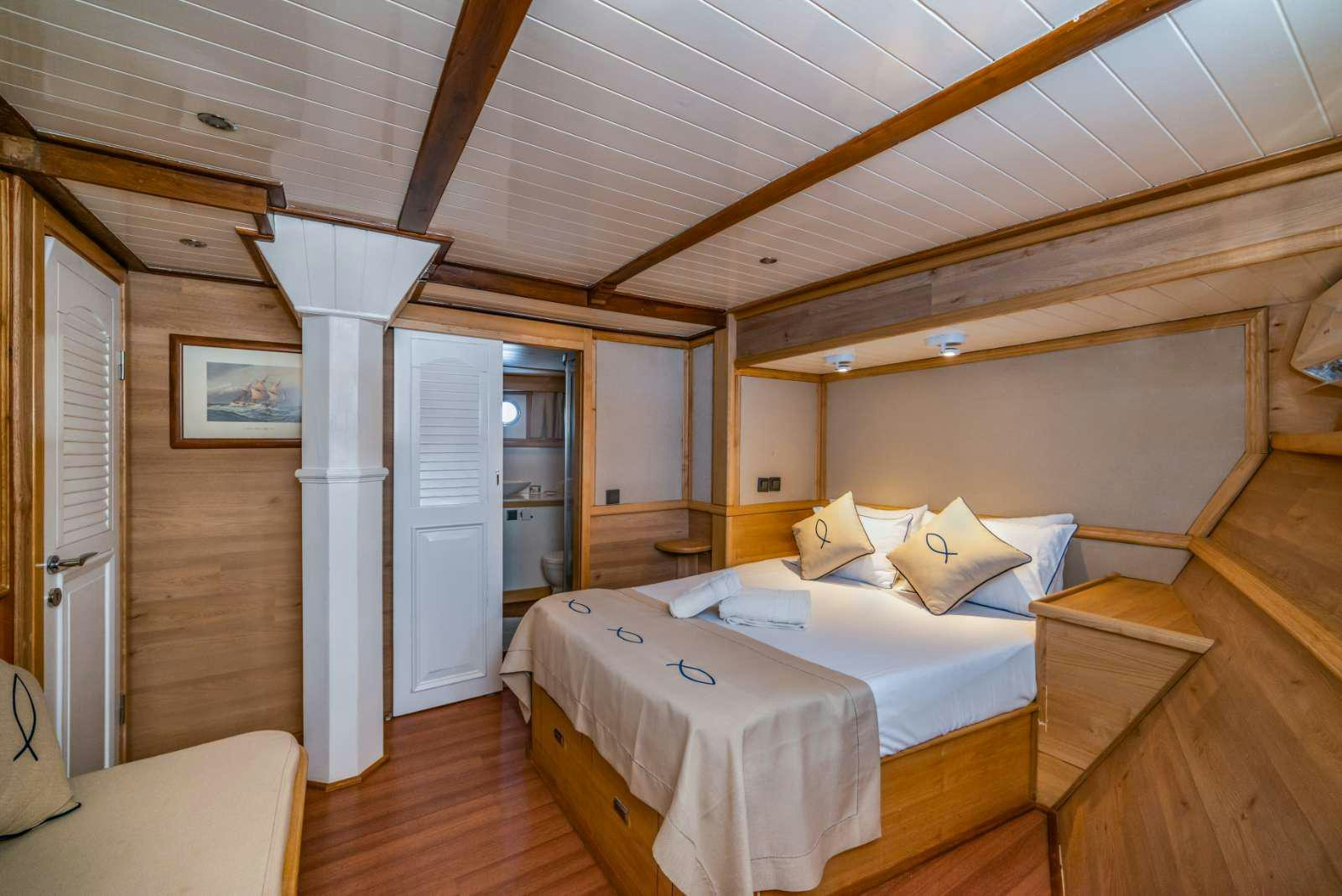 a room with two beds aboard AMAZON SOLO Yacht for Charter