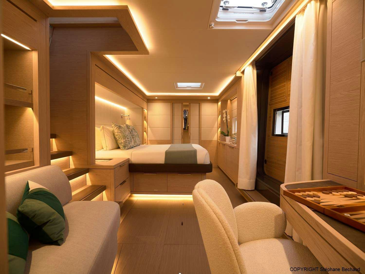 a room with couches and a table aboard KAJIKIA Yacht for Charter