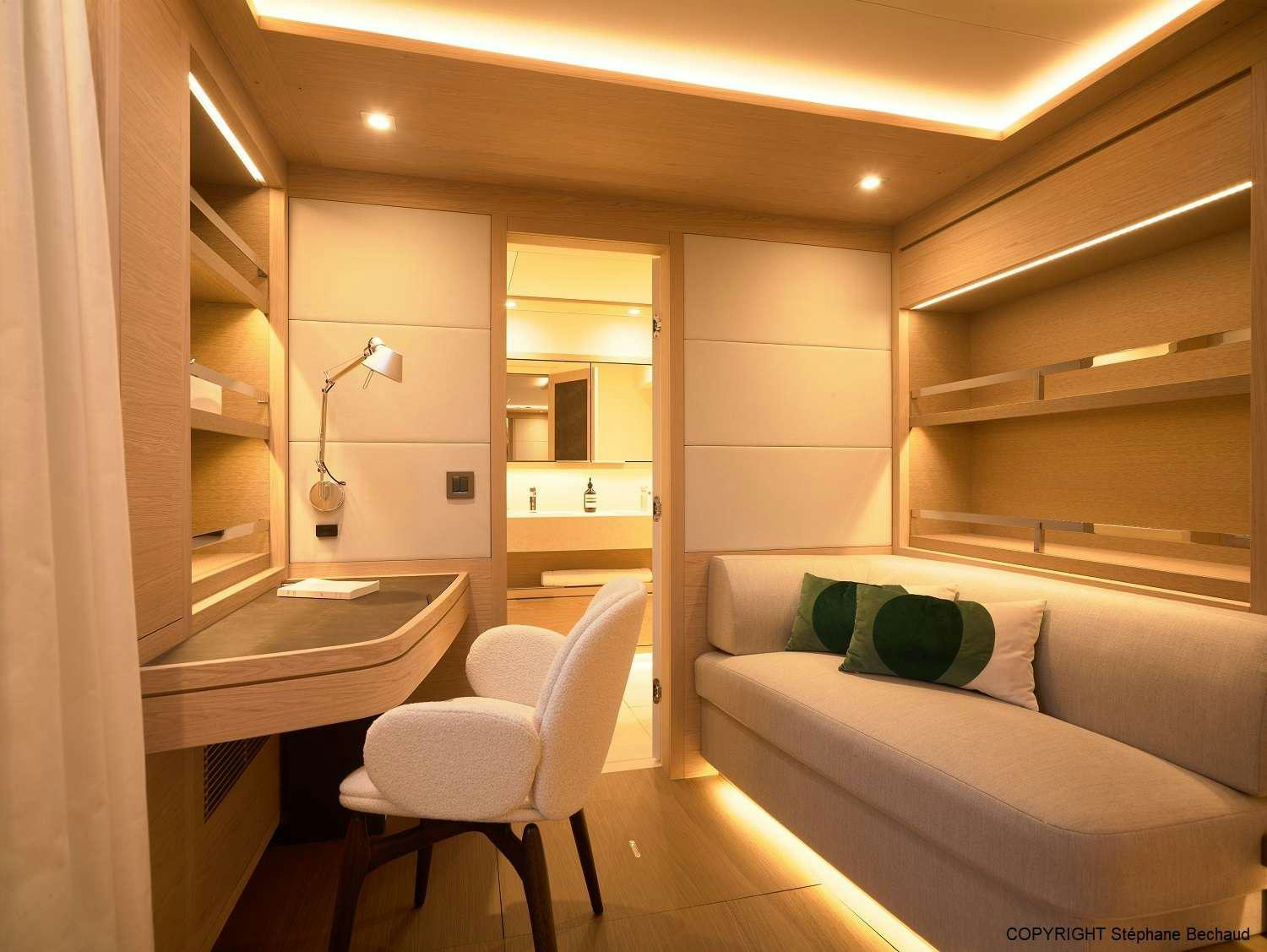 a room with a couch and a sink aboard KAJIKIA Yacht for Charter